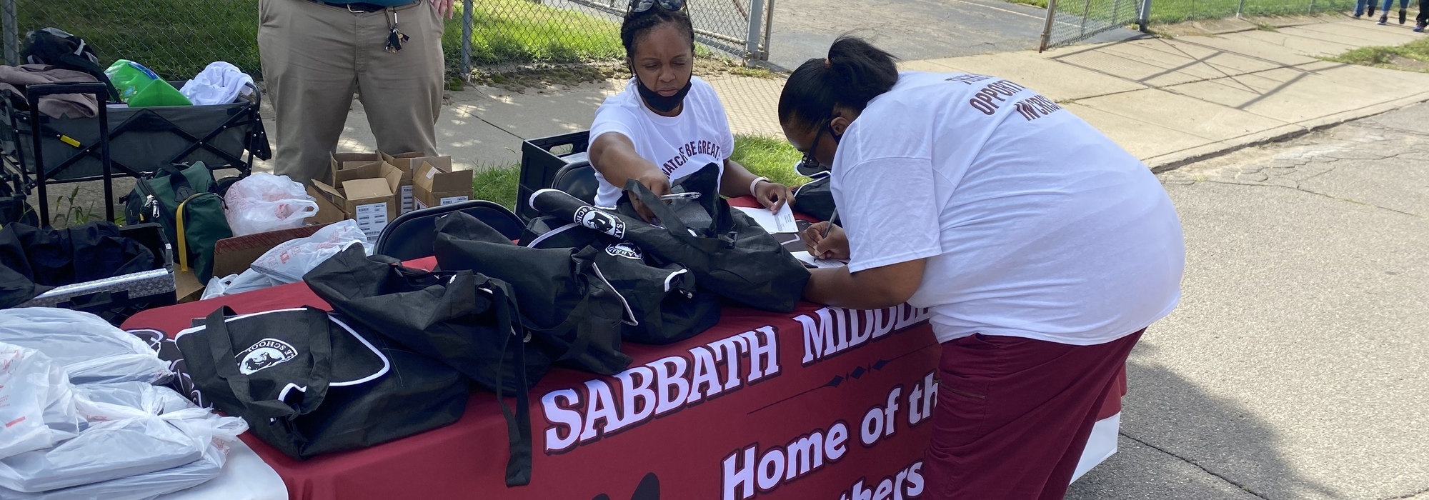 Sabbath school at the backpack giveaway handing out technology to students during the pandemic.