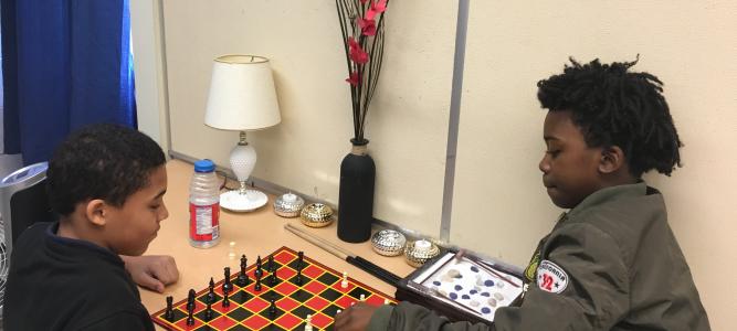 Students engaging in a chess match